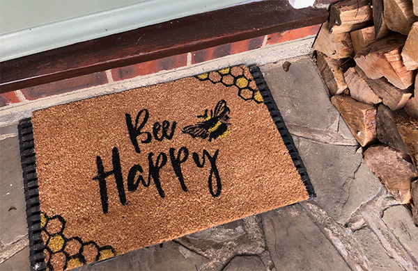 New front doormat keeps me smiling...Bee Happy!
